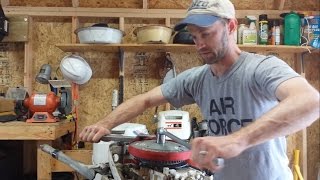 How to Remove a Flywheel on a Johnson  Evinrude  OMC Outboard Motor [upl. by Feinstein801]