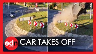 Shocking Moment Car ‘Flies Over Roundabout in Poland [upl. by Akirat474]