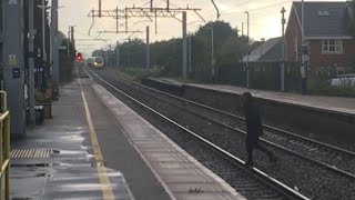 Person JUMPS ONTO RAILWAY TRACKS in front of 390 046 [upl. by Aicilana256]