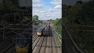 Avanti West Coast Class 390 Pendolino passing alongside Class 66 hauling Steel Wagons on the WCML [upl. by Ahtela]