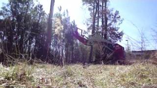 Takeuchi TL150 Skid Steer with a Fecon Mower [upl. by Tahmosh296]