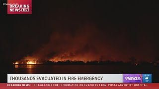 Fire burns neighborhood near Harper Lake west of Louisville [upl. by Erehs]