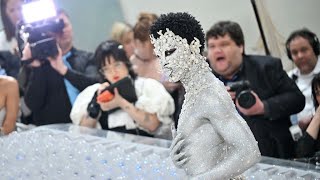 Lil Nas X Arrives at Met Gala 2023 Covered Head to Toe in Crystals  NBC New York [upl. by Copeland427]