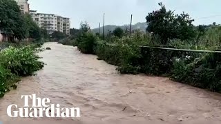 Heavy rains flood streets and trap hundreds in China [upl. by Ninnetta]