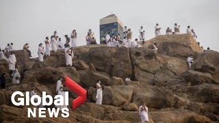 Haj Pilgrims scale Mount Arafat for sacred ritual in Mecca [upl. by Attenoj819]