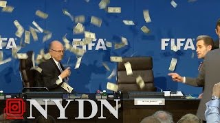 Comedian throws money at Sepp Blatter at FIFA Press Conference [upl. by Notneiuq742]