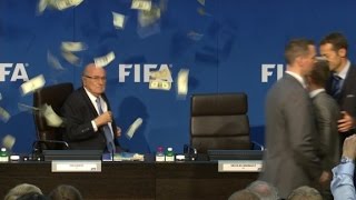 Comedian throws money at Blatter during press conference [upl. by Attenaj671]