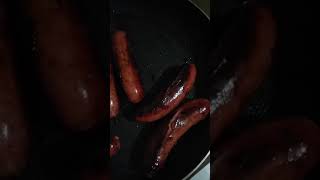 Sausages sizzling in the frying pan [upl. by Llenol]