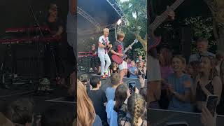 Cant believe this happened 🤯 10 year old asks band at festival to let him play guitar [upl. by Refenej818]