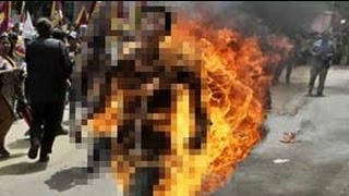 Tibetan protester sets himself on fire ahead of China Presidents visit to Delhi [upl. by Arraet438]