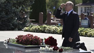 Russias Putin kneels down at memorial to victims of 2004 deadly Beslan siege [upl. by Eicart]