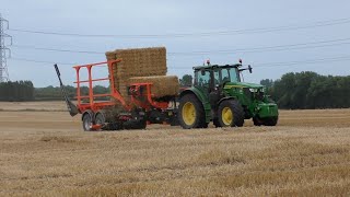 John Deere 6R155 Chasing Bales with Big Bale Transtacker [upl. by Atiraj]