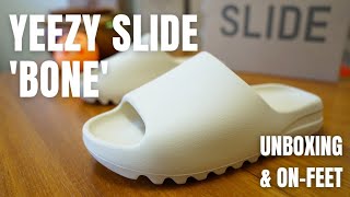 RESTOCKING FRIDAY Yeezy Slide Bone Unboxing OnFeet Sizing amp Review [upl. by Yllehs]