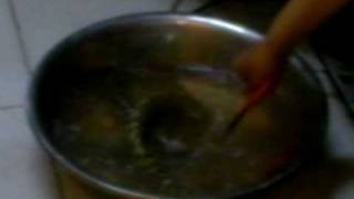 Woman tosses live Snake into boiling water [upl. by Oria]