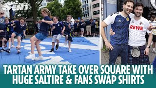 Tartan Army play football on huge Saltire and fans swap shirts in Cologne [upl. by Herschel]