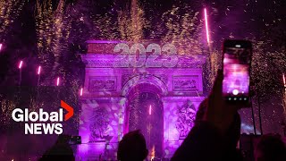 New Years 2023 Paris France gets the party started with fireworks smoke show over Arc de Triomphe [upl. by Fulvia]