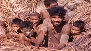 Natives group together in a foxhole in Eniwetok Atoll Marshall Islands during WoHD Stock Footage [upl. by Fernald201]