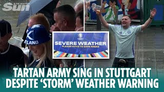 Tartan Army sing in the street not bothered by Stuttgart storm weather warning [upl. by Verdie]