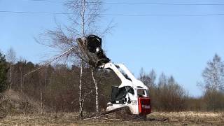 Bobcat T320 with Forestry Cutter and Bradco [upl. by Kristoffer837]