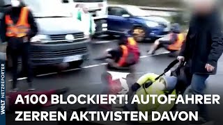 A100 IN BERLIN Aktivisten blockieren Stadtautobahn  Autofahrer zerren sie von der Straße [upl. by Cram758]