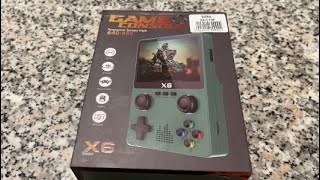 Unboxing Review and Demo of the X6 Handheld Game Console [upl. by Gnap470]