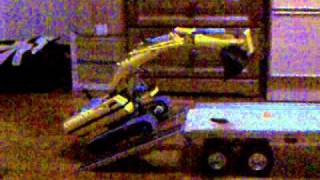 Lego 8043 Excavator mounting a Tamiya flatbed trailer [upl. by Ahsekim434]