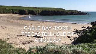 Cable bay sandy beach Porth Trecastell Isle of Anglesey is on the Anglesey Coastal Path [upl. by Notneuq]